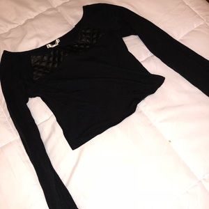 Long sleeve crop top. Leather quilt at neckline